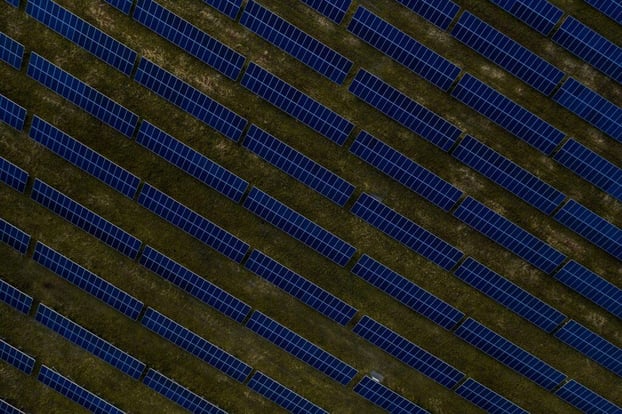 aerial-top-view-of-a-solar-panels-power-plant-AN32P8R-1024x682