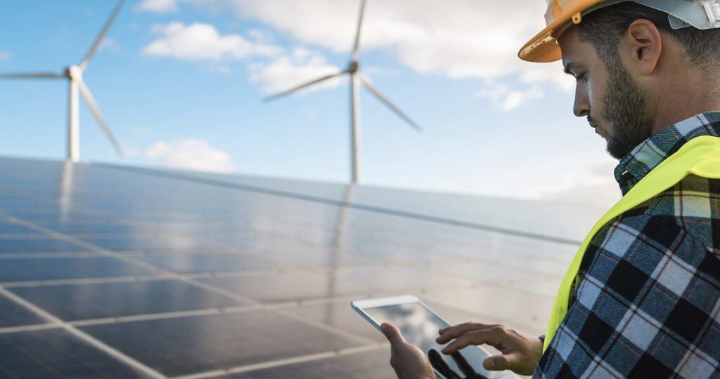 young-man-working-with-digital-tablet-at-renewabl-2021-09-02-14-44-39-utc-1024x540